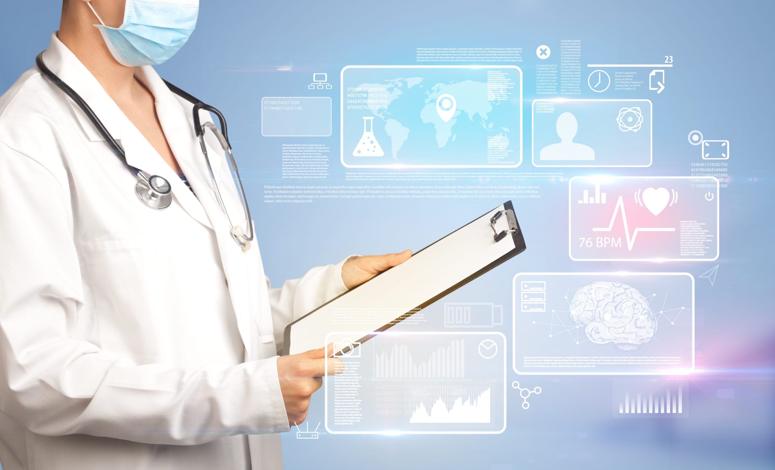 Clinician holding a clipboard in front of digital health data
